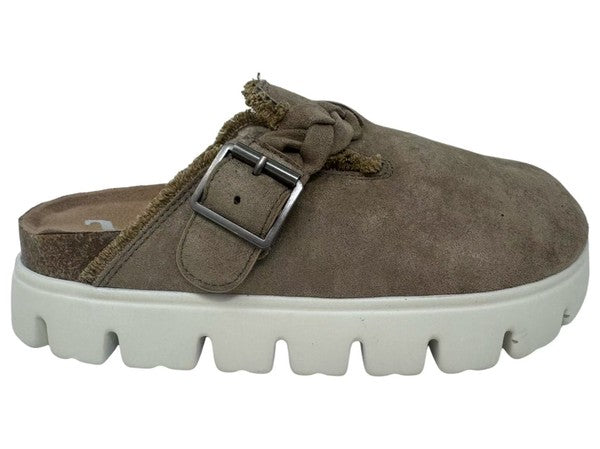 Brown suede clog shoe with a buckle on a white background