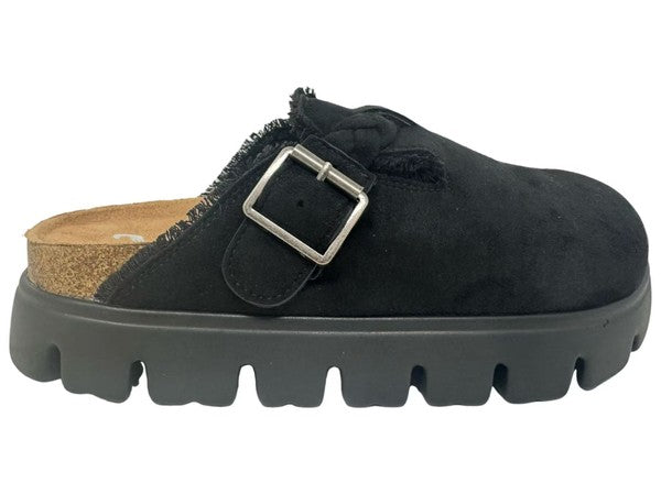 Black suede clog shoe with a buckle on a white background