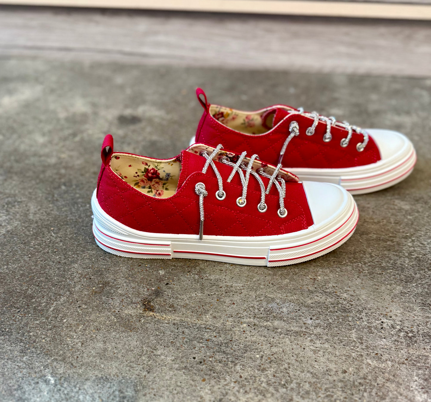 red quilted sneaker with rhinestone laces