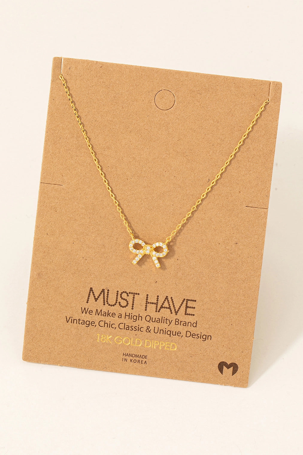 Rhinestone bow pendant necklace