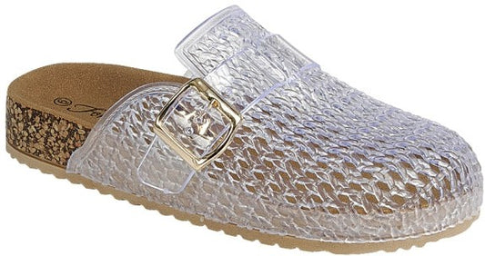 Woman modeling clear jelly buckle clogs with cork footbed and gold hardware, styled with cropped denim jeans, available at Twisted Sisters Shoetique in Waco, Texas.