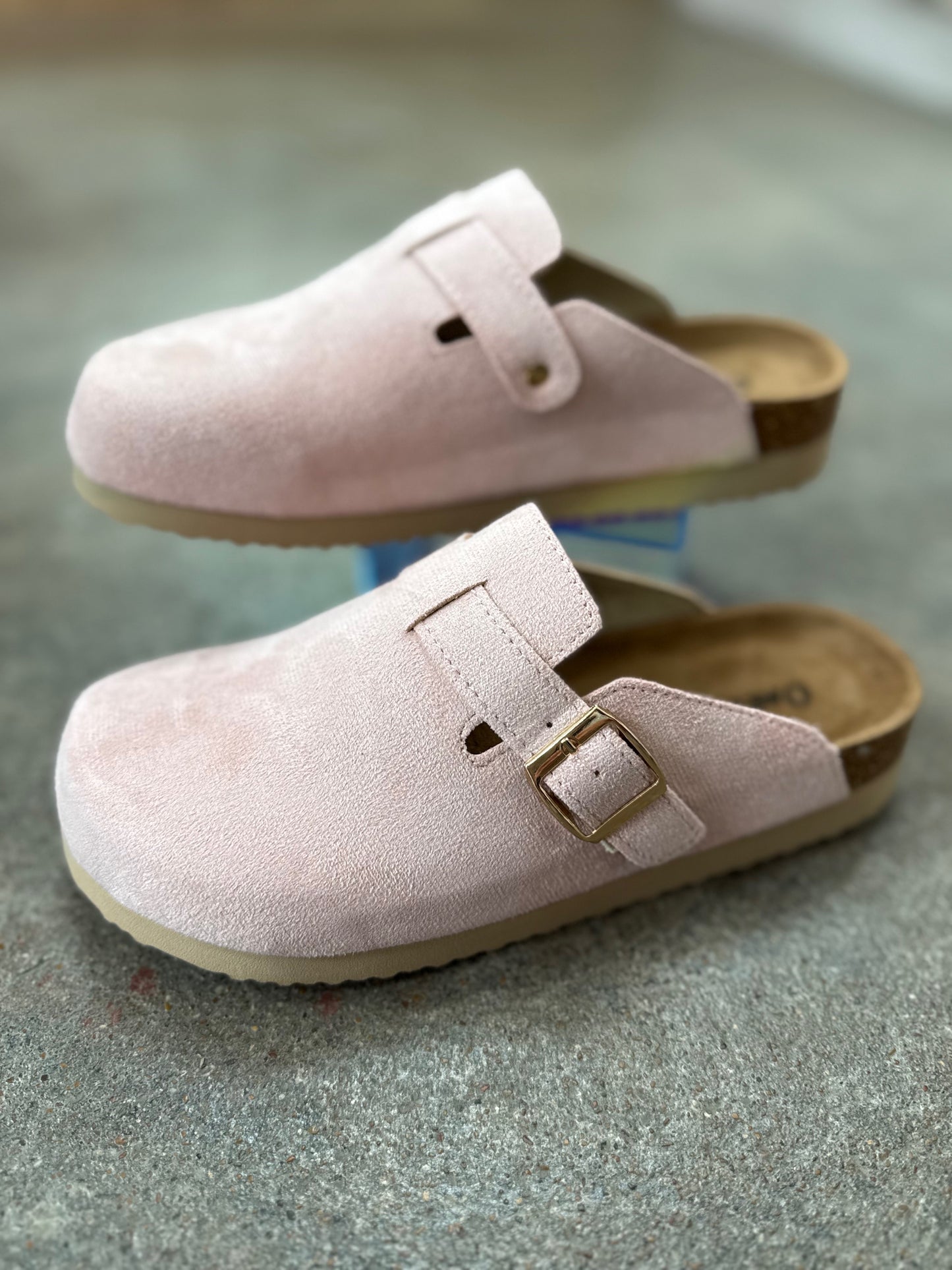 Side view of women’s light pink mule shoes