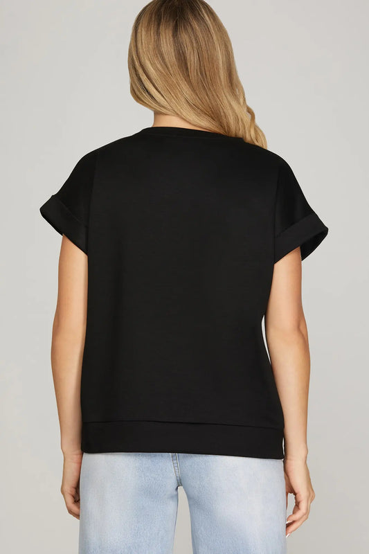 Soft black knit casual top for layering and everyday wear