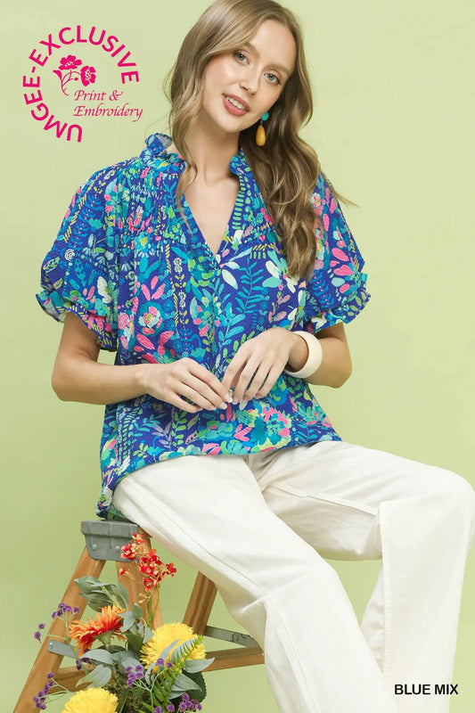 Blue botanical print flutter sleeve blouse with split V-neck and notched collar