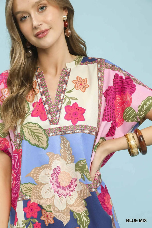 Blue boho floral patchwork V-neck top with oversized fit and high-low hem