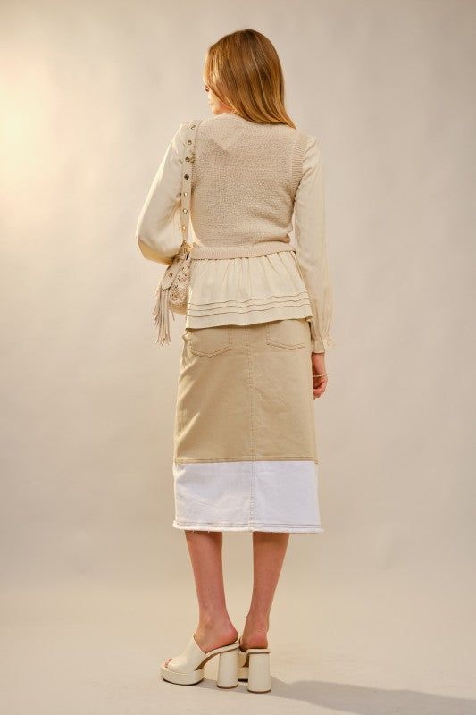 Back view of women’s long sleeve peplum ruffle top from Waco boutique