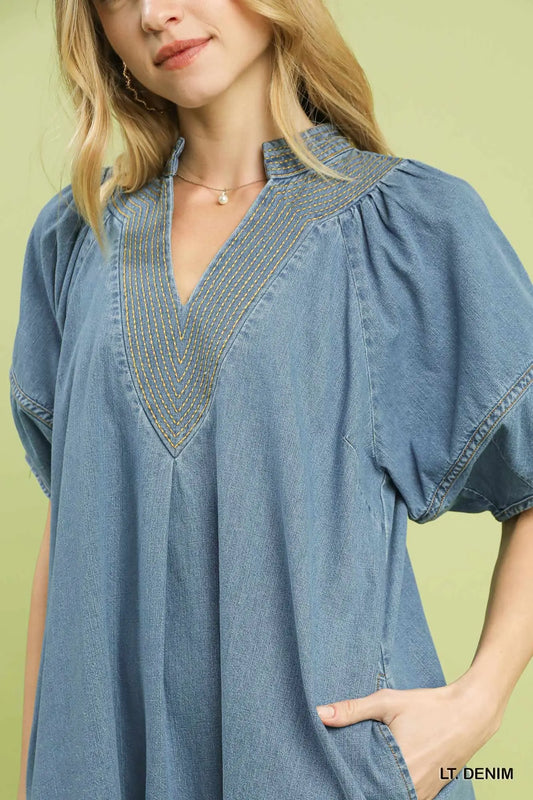 Light denim mini dress with puff sleeves and deep V-neck