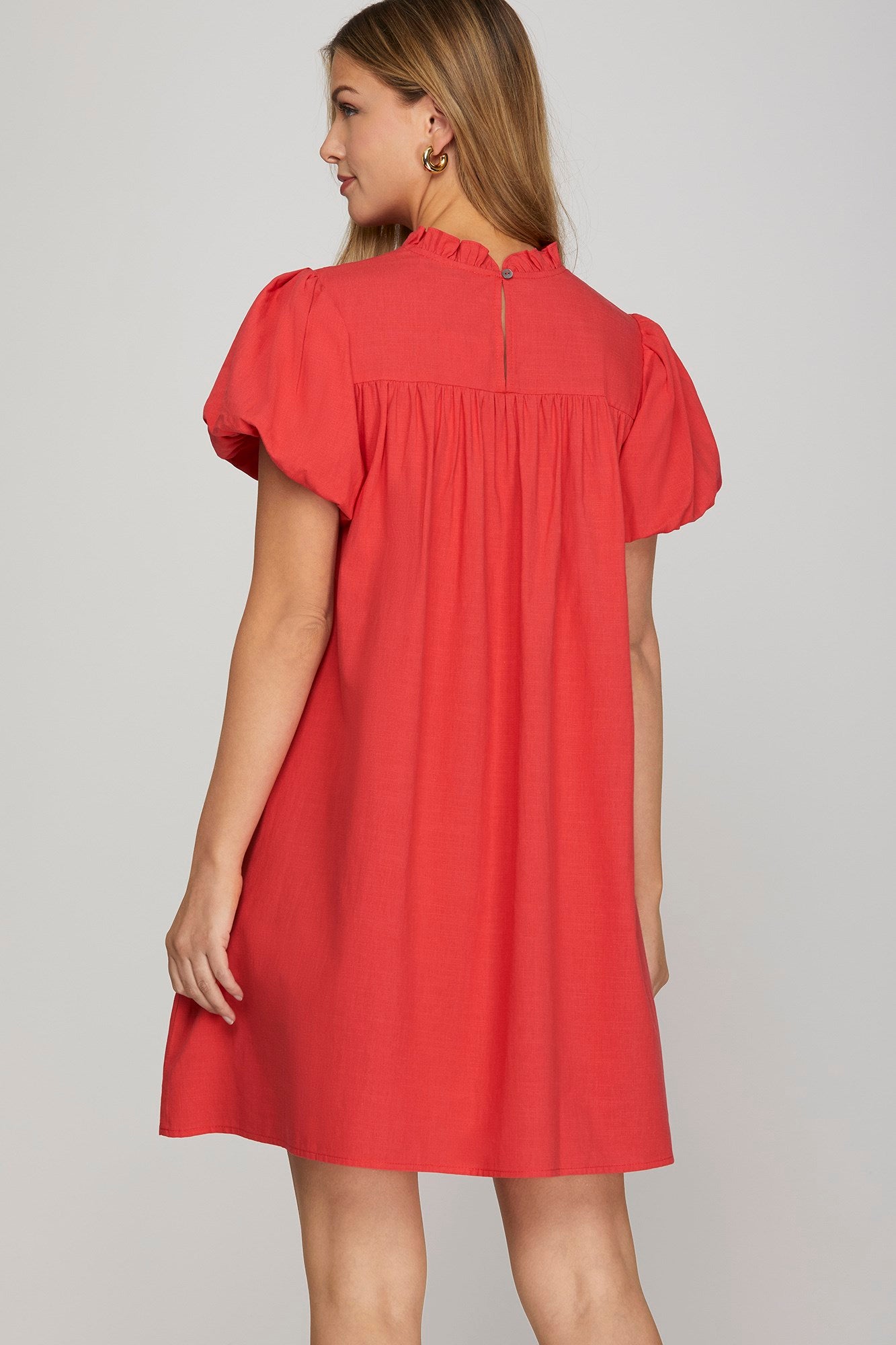 Back view of red bubble sleeve mini dress