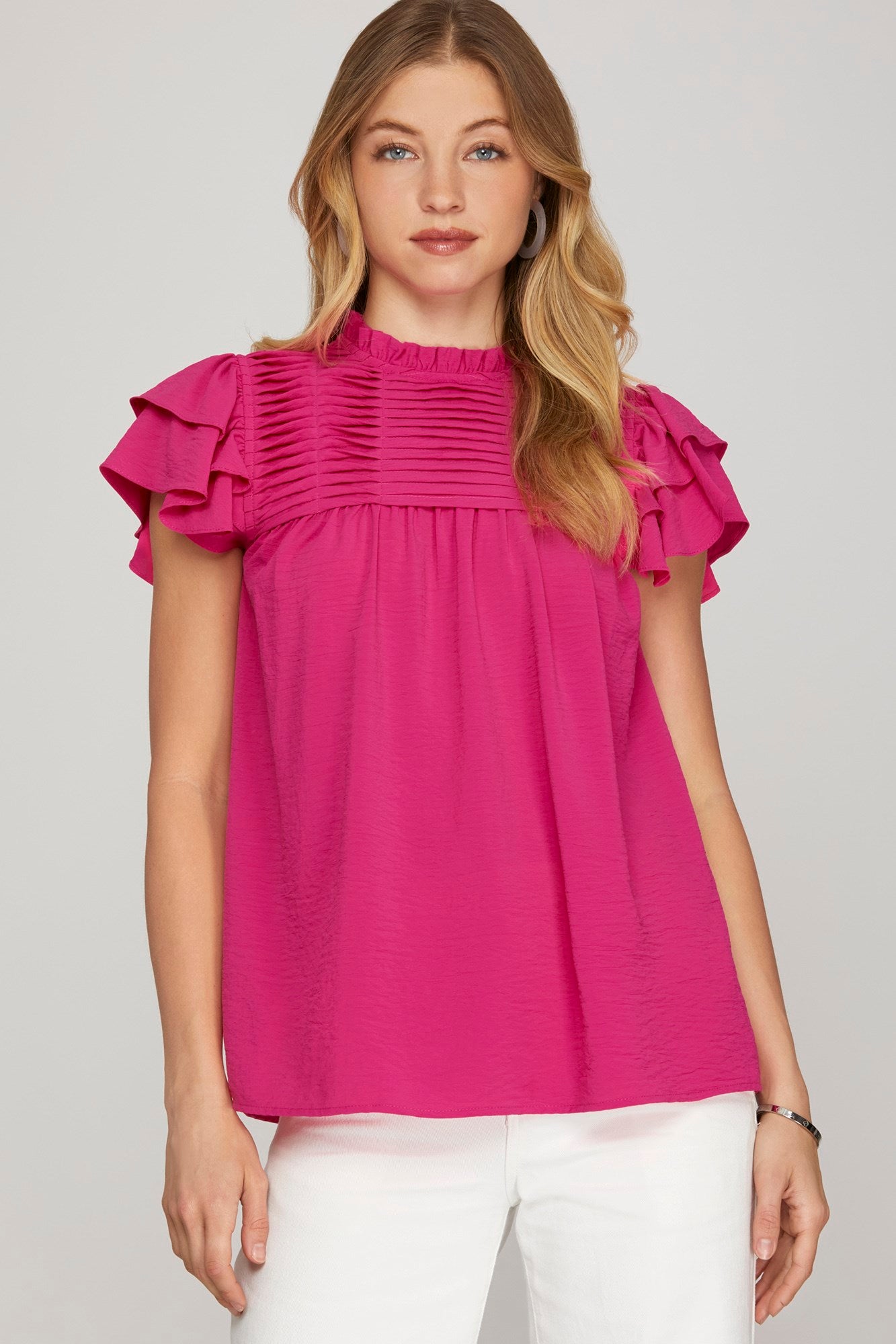 Women’s hot pink ruffle sleeve pleated yoke woven top from Twisted Sisters Shoetique in Waco Texas