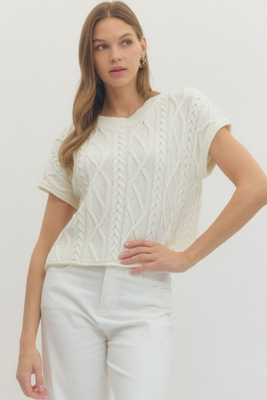 Solid cable knit short sleeve top with ribbed neckline sleeves and hem medium weight boutique knitwear