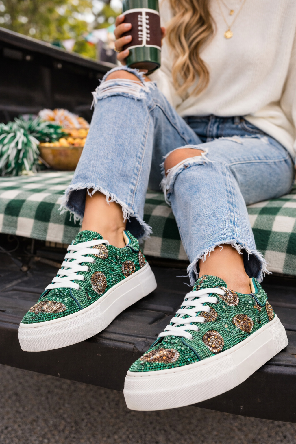 Blue by Betsey Johnson Sidny football print rhinestone platform sneakers with 1.5 inch platform sole.
