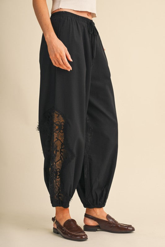     Black lace insert pants with elastic waist and ankle cuffs