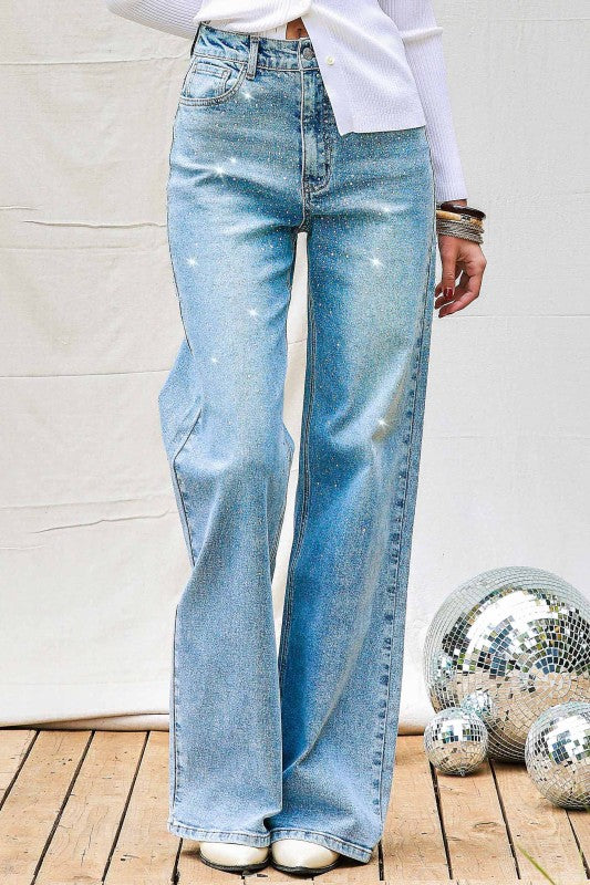 Front view of women’s iridescent rhinestone wide leg denim jeans
