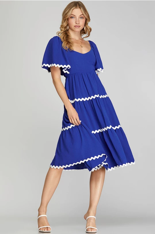 tiered midi blue dress with white ricrac trim tie back