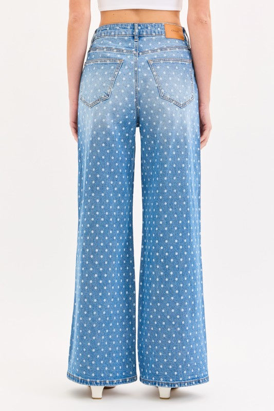 Light blue jeans with white polka dots on a white background