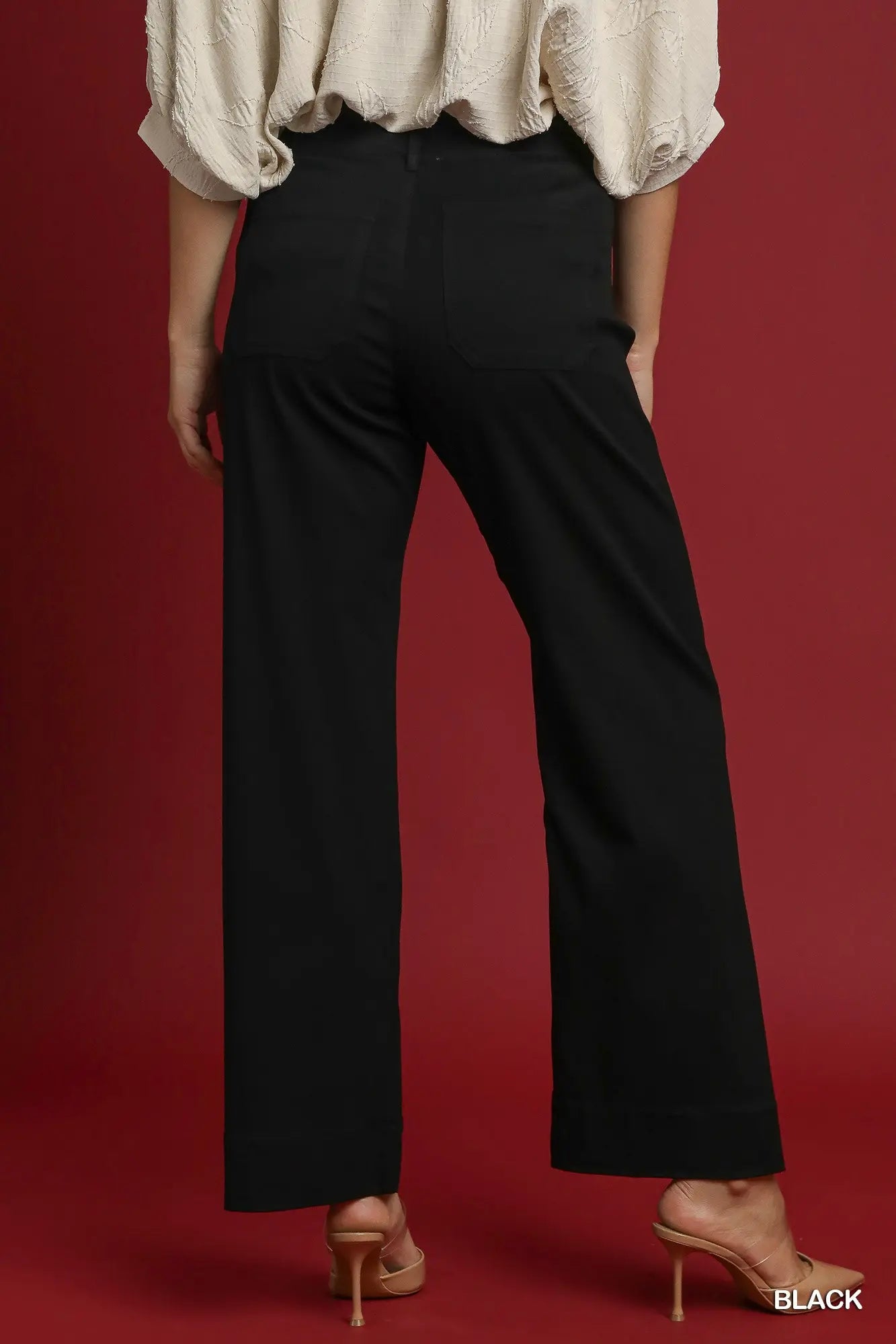 Back view of women’s black stretch pants from Waco boutique