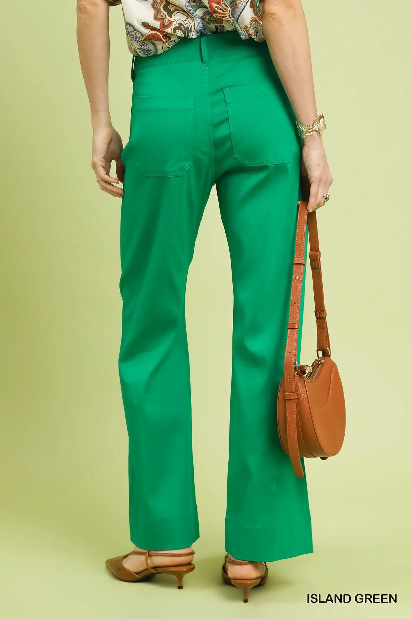 Back view of women’s green stretch pants from Waco boutique