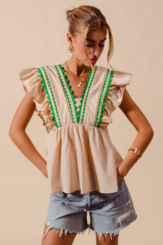 Women’s boutique ecru sleeveless top with green trim from Twisted Sisters Shoetique in Waco Texas