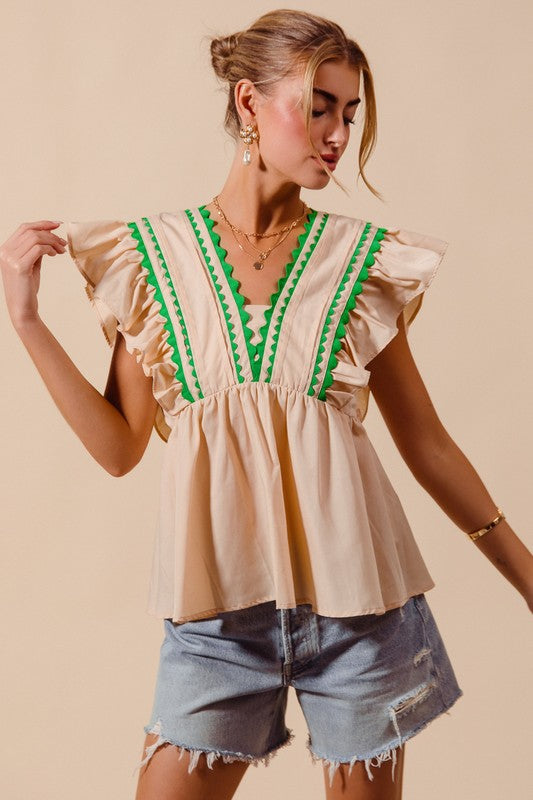 Trendy women’s ecru sleeveless woven top with green wave trim from Twisted Sisters Shoetique in Waco Texas