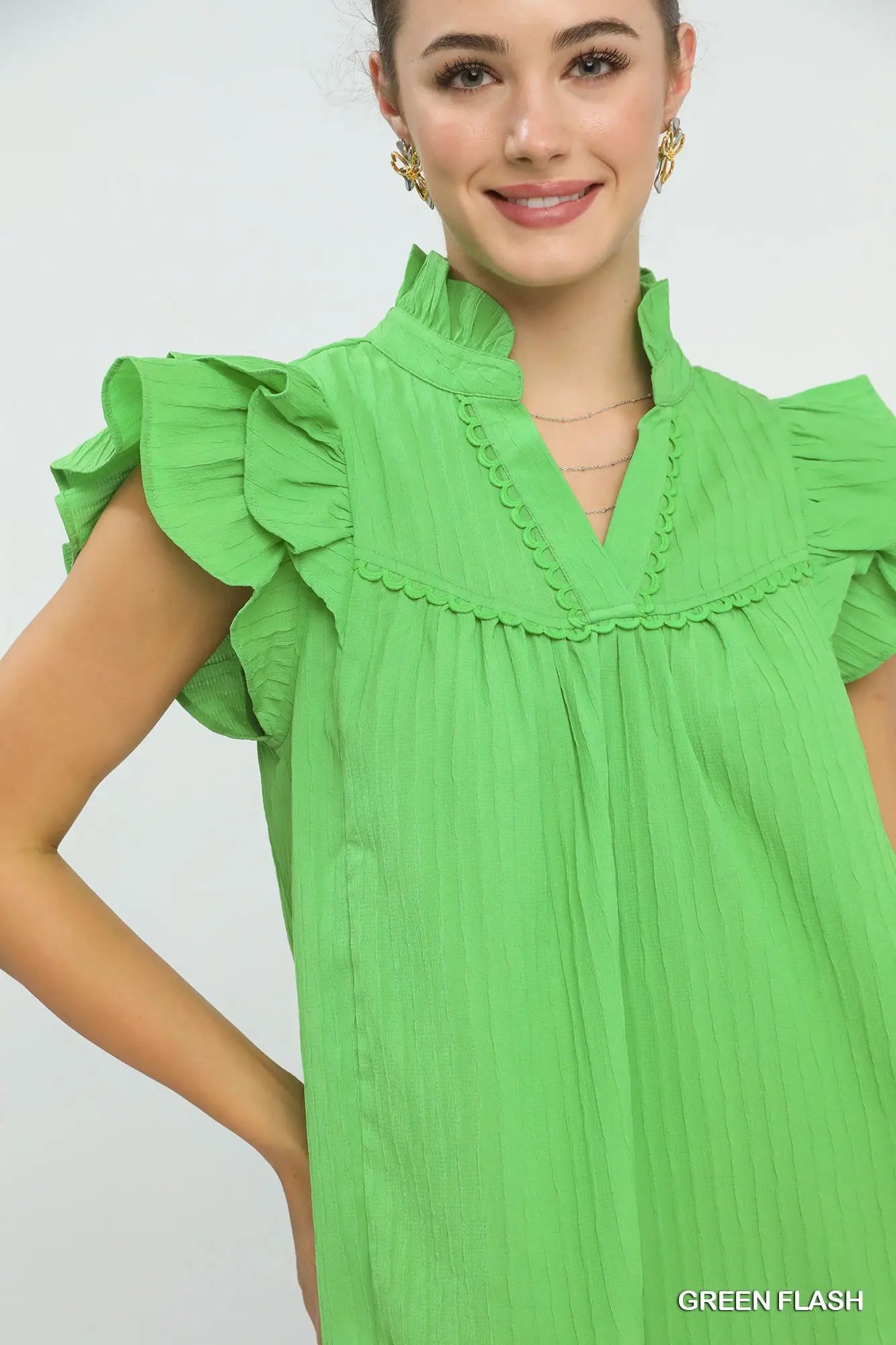 Split V-neckline detail on women’s textured babydoll top boutique Texas