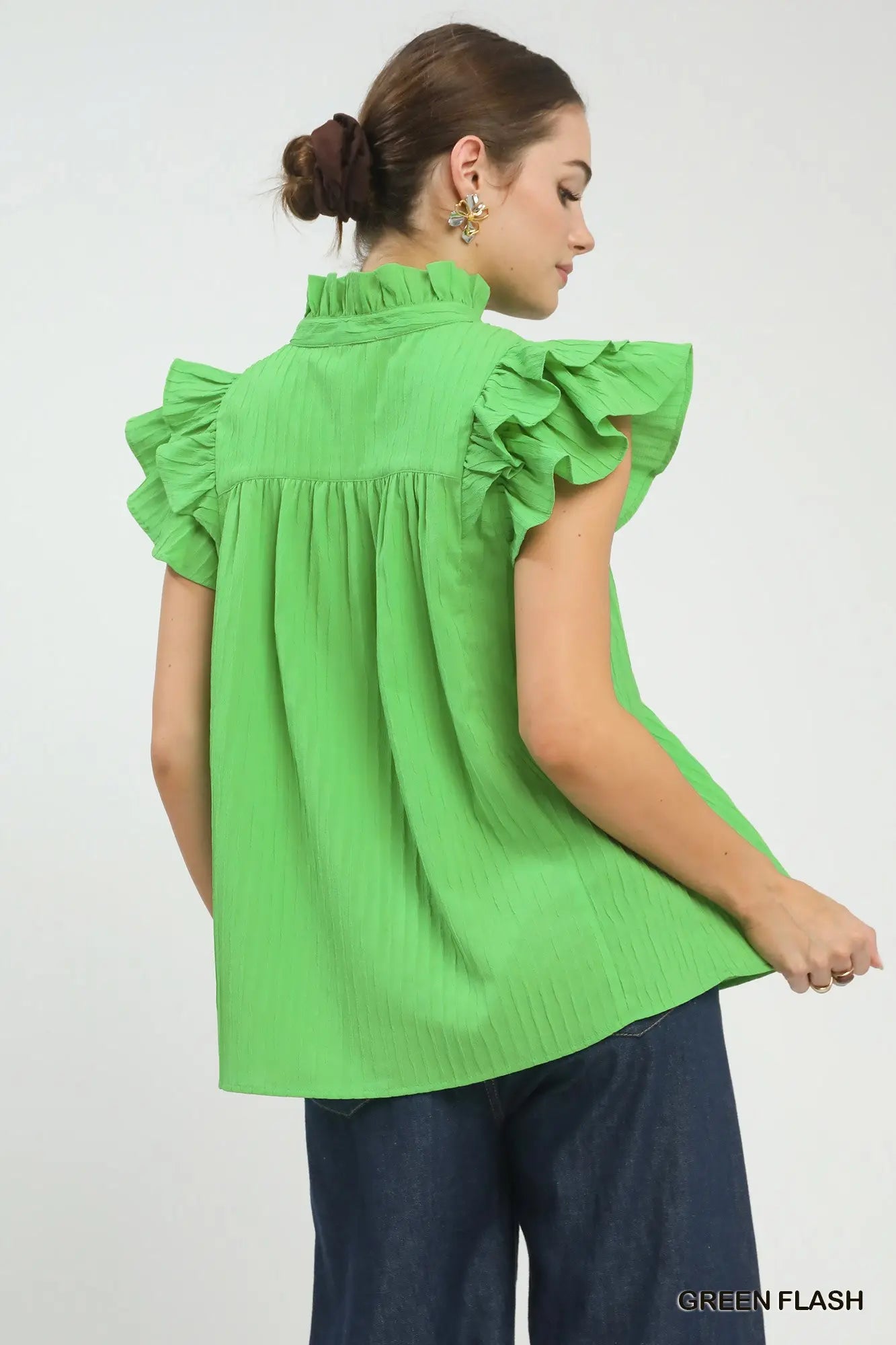 Back view of women’s green textured babydoll top from Waco boutique