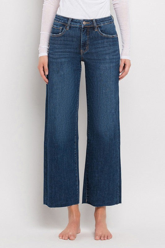 Front view of mid rise dark wash wide leg jeans with tummy control