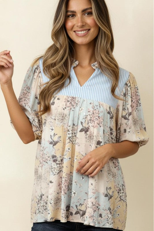 Front view of floral blouse with frilled notch neckline