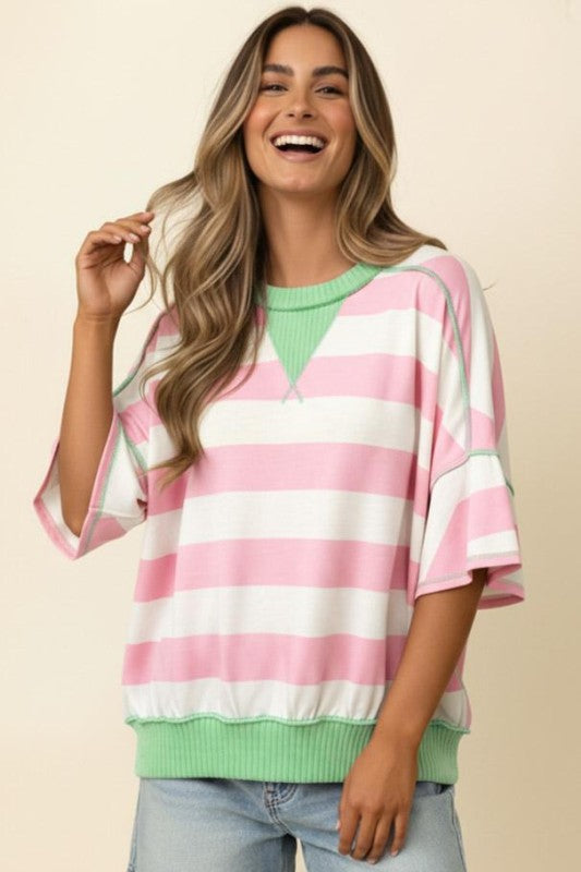 Front view of oversized color block stripe knit pullover