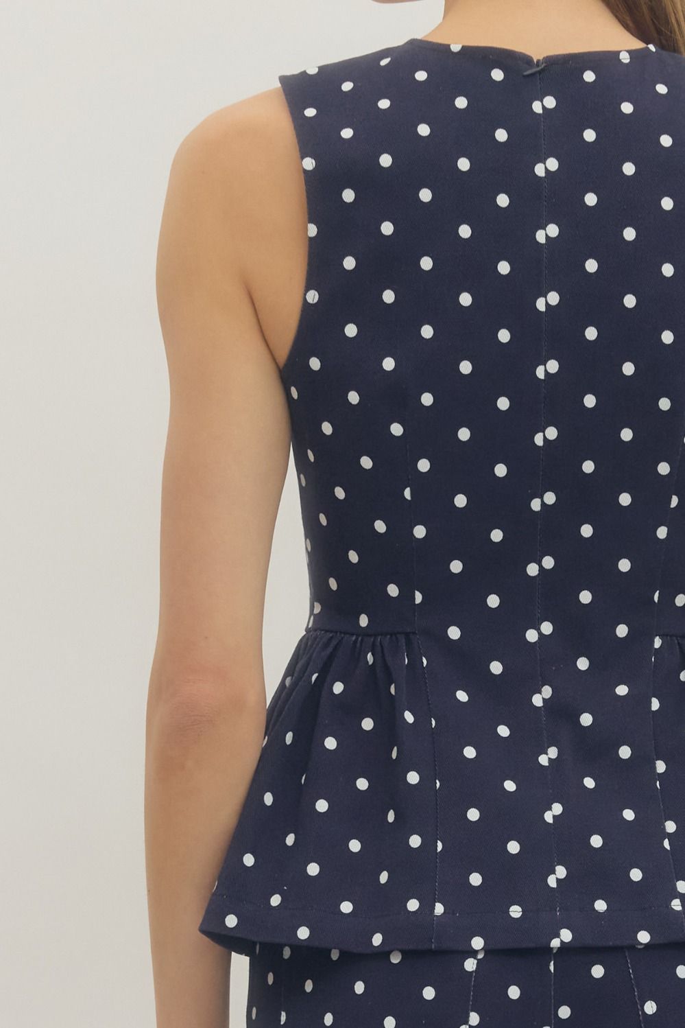 Navy Polka Dot Peplum Sleeveless Top - Twisted Sisters Shoetique