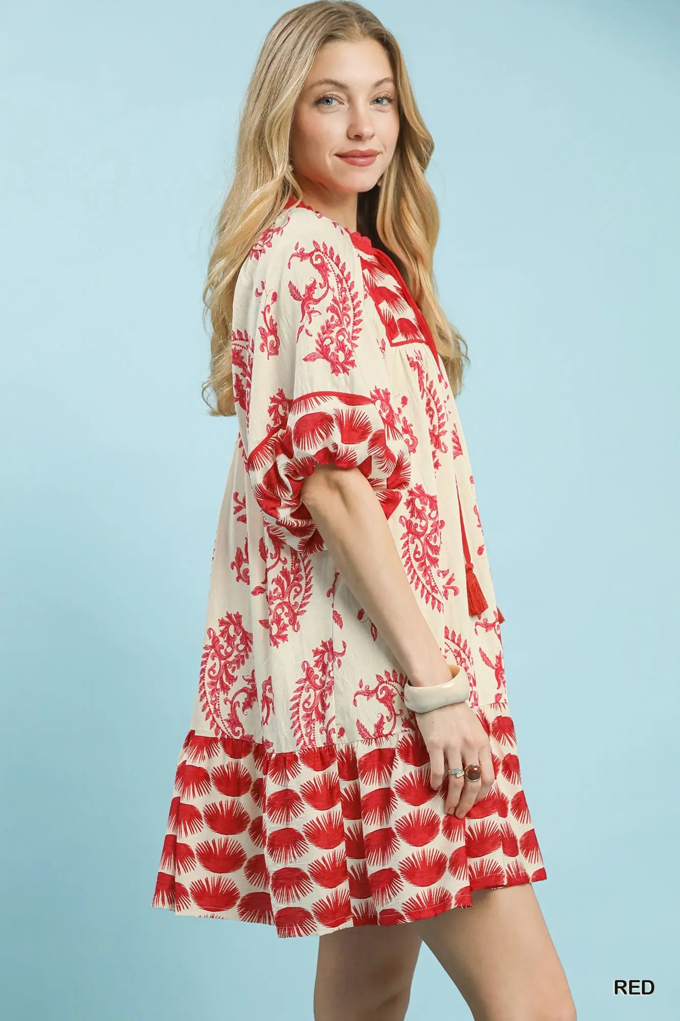 Women’s tiered mini dress with tassel tie neckline