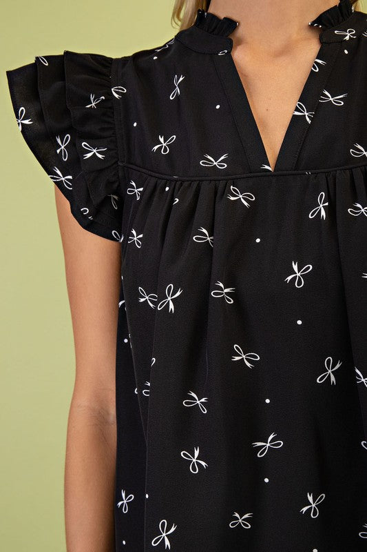 Black printed top styled with denim