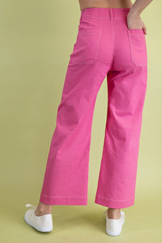 Bright pink wide leg pants styled casually