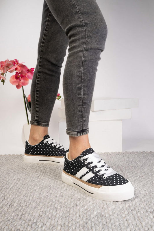 Corkys That’s Her white sneakers with black stripes and leopard laces