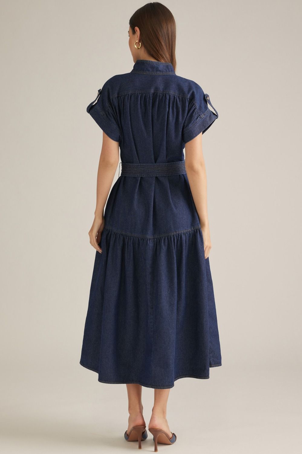 Women's dark denim belted midi dress with stand collar, button front, cap sleeves and tiered skirt back view