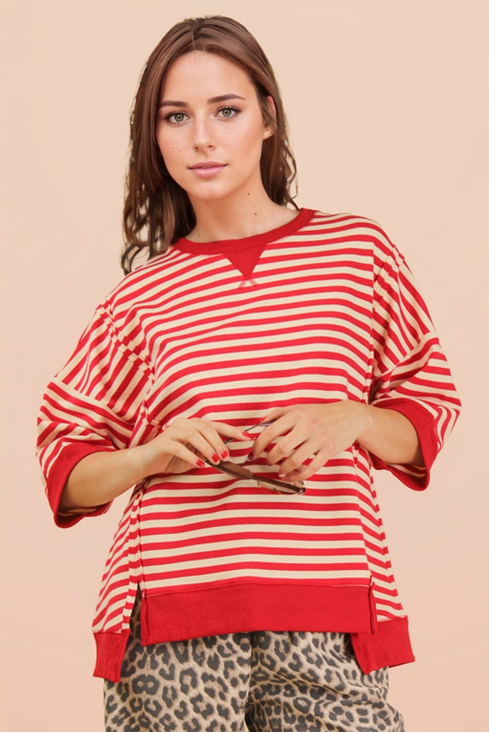 Red and cream oversized striped knit top with drop shoulders and contrast trim