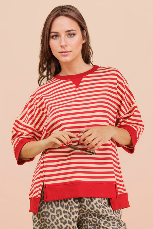 Red and cream oversized striped knit top with drop shoulders and contrast trim