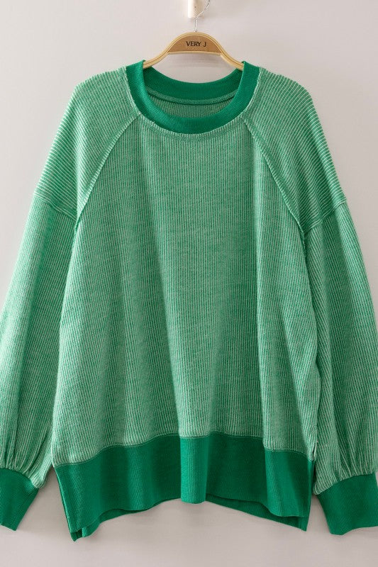 Women’s green washed thermal long sleeve pullover with raglan sleeves and ribbed trim
