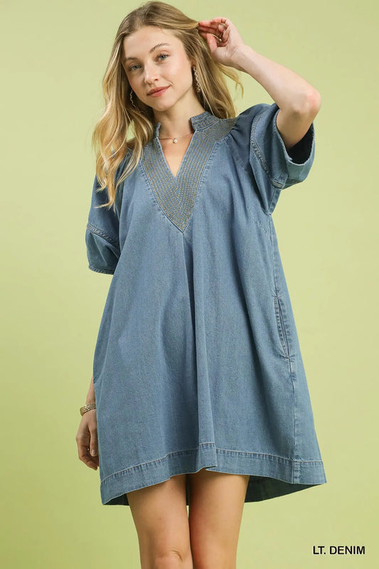 Light denim mini dress with puff sleeves and deep V-neck