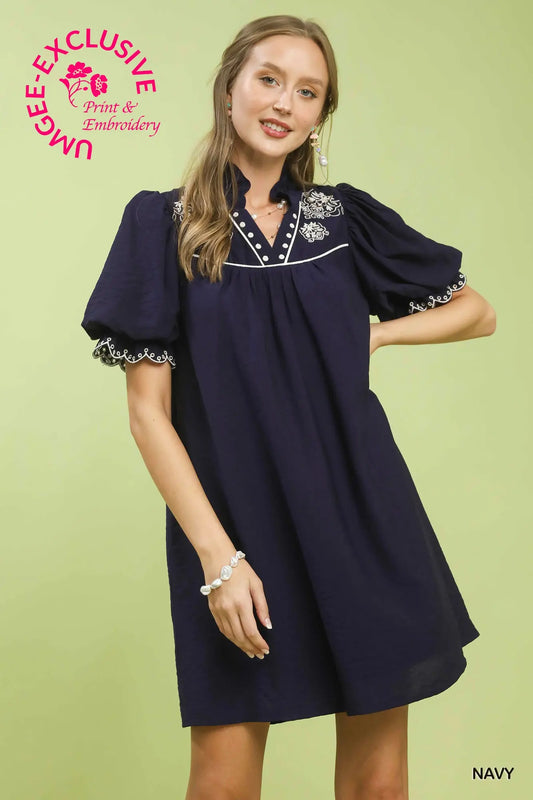 Navy seersucker A-line mini dress with split V-neck and scalloped details