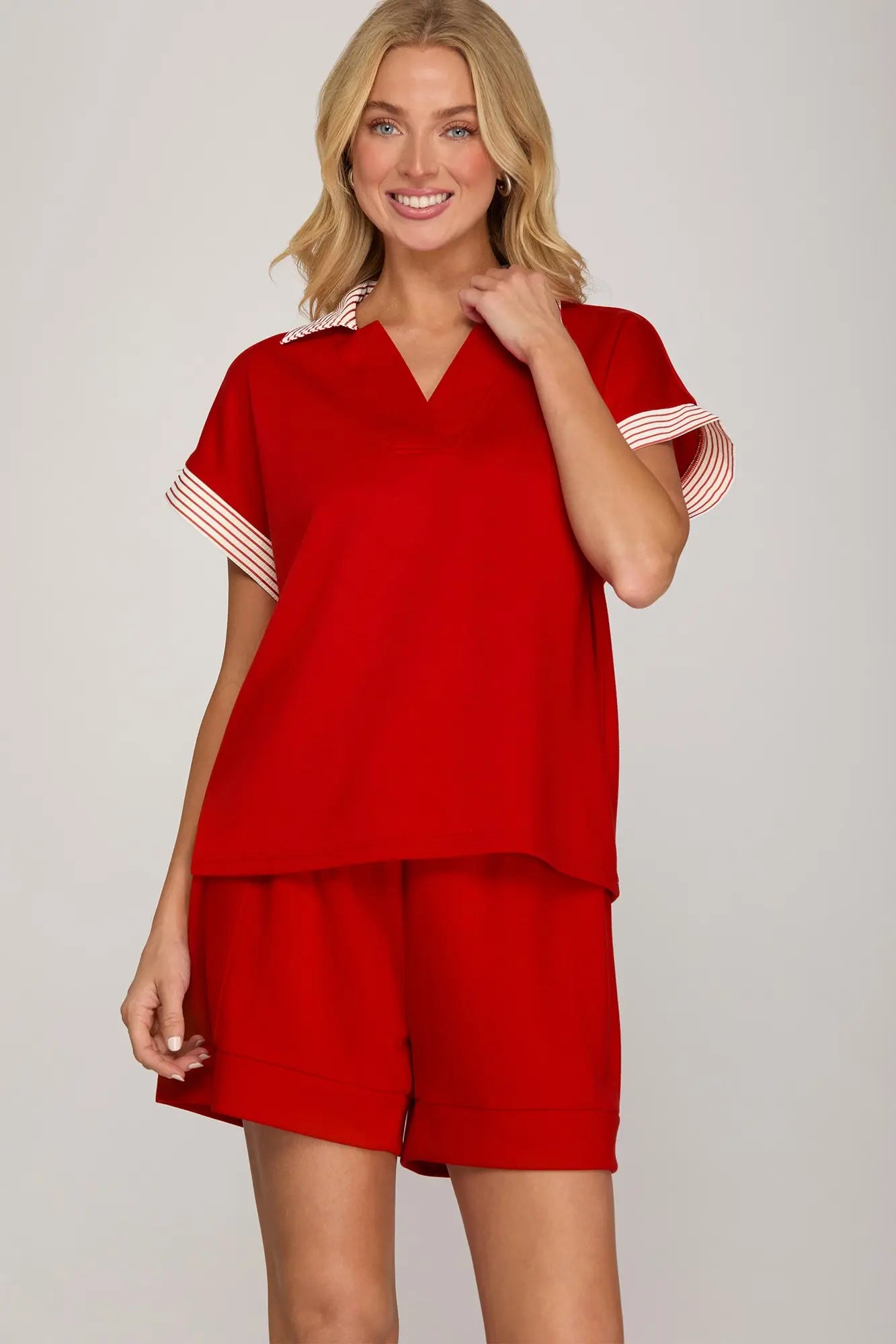 Women’s red collared knit top