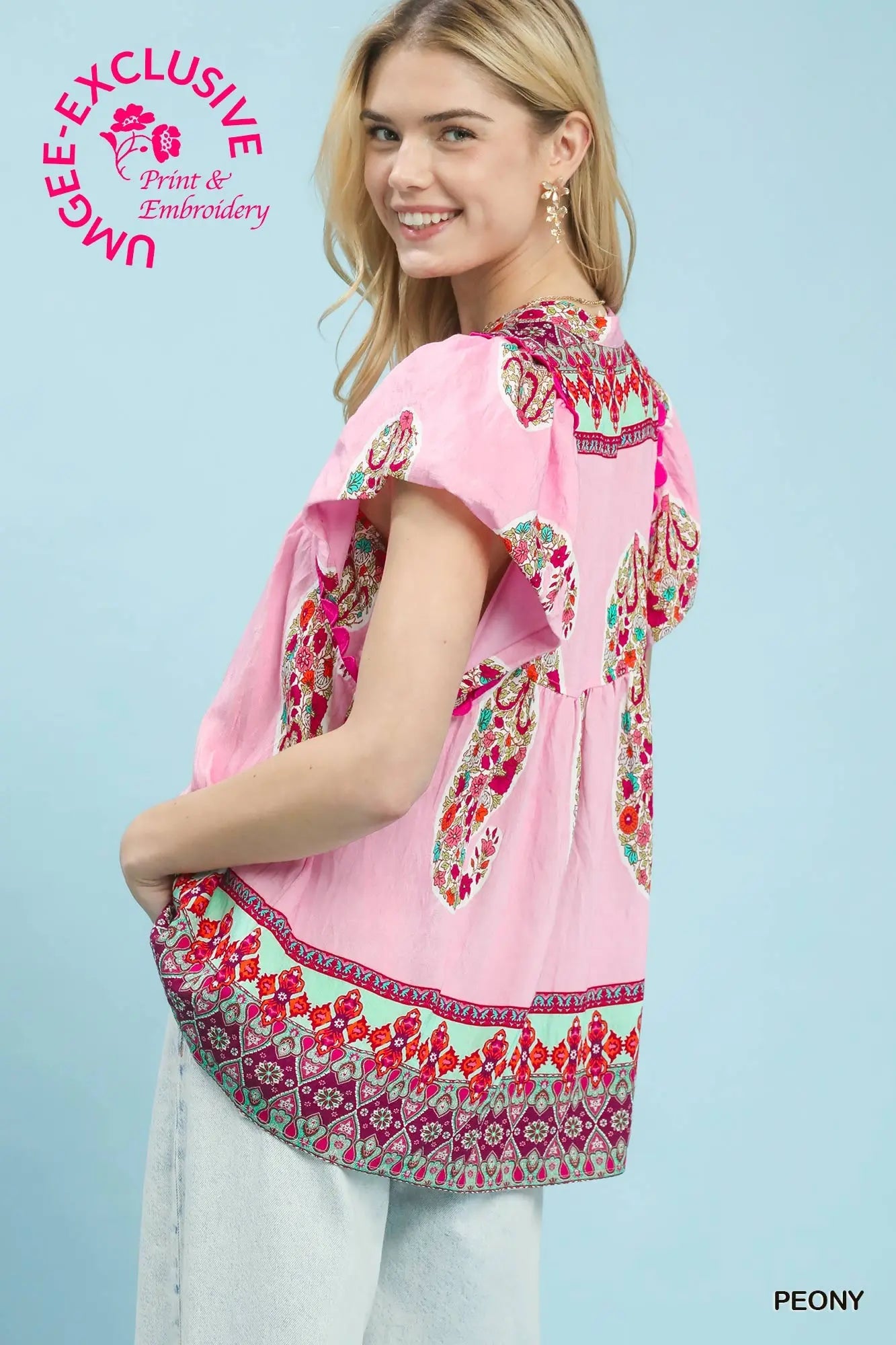 Peony color blouse styled with denim