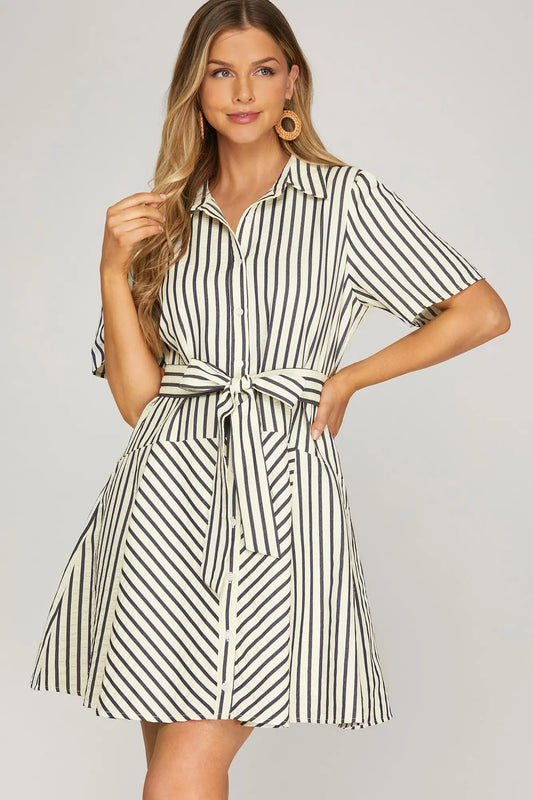 woman wearing striped mini dress with tie waist and pockets