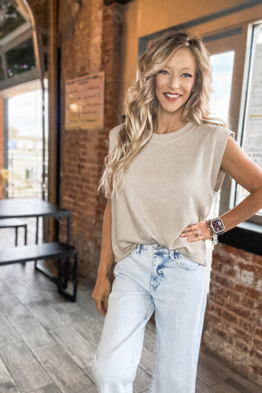 Women’s boutique taupe knit top styled casually