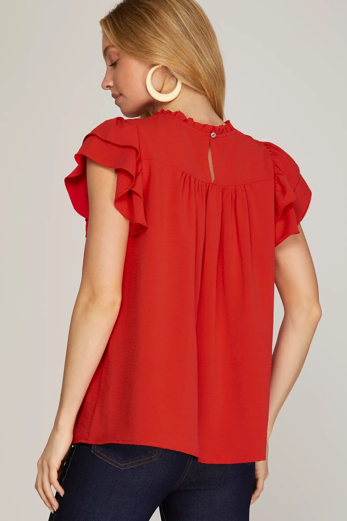 Women’s boutique red pleated blouse back view 