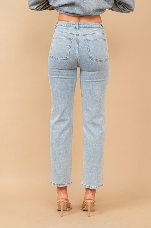 Back view of women’s high rise denim jeans from Waco boutique