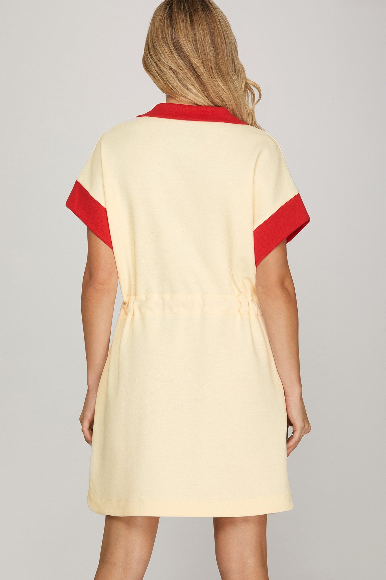 Back view of red color block zip-up mini dress
