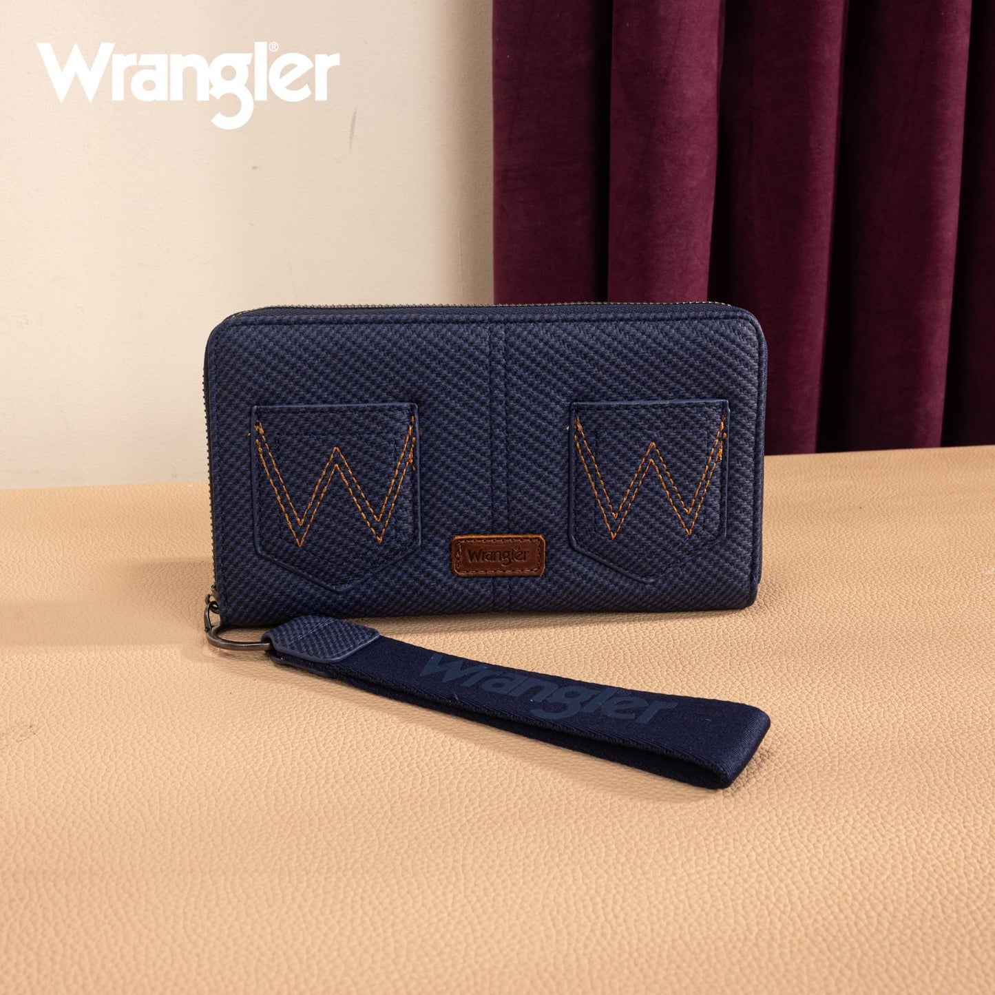 Wrangler navy wristlet wallet with double Western pocket design and W stitching